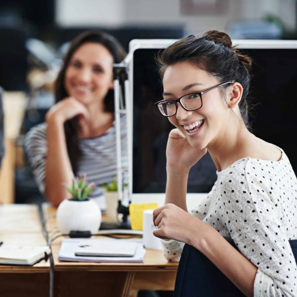 business-with-exuberance-portrait-of-young-office-workers-sitting-at-their-computers-.jpg